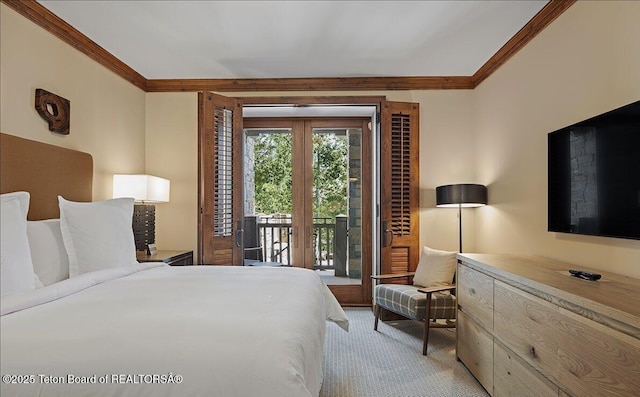 carpeted bedroom with ornamental molding and access to exterior