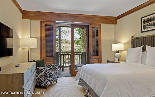 bedroom featuring ornamental molding, carpet flooring, and access to outside