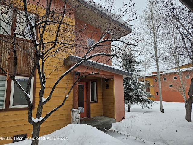 view of snow covered property