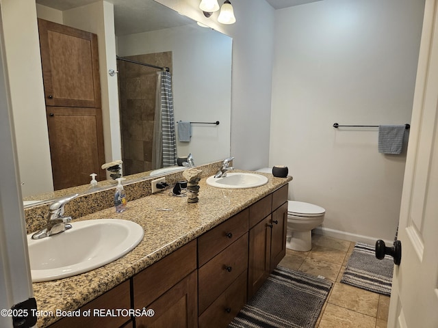 bathroom featuring vanity, toilet, and curtained shower