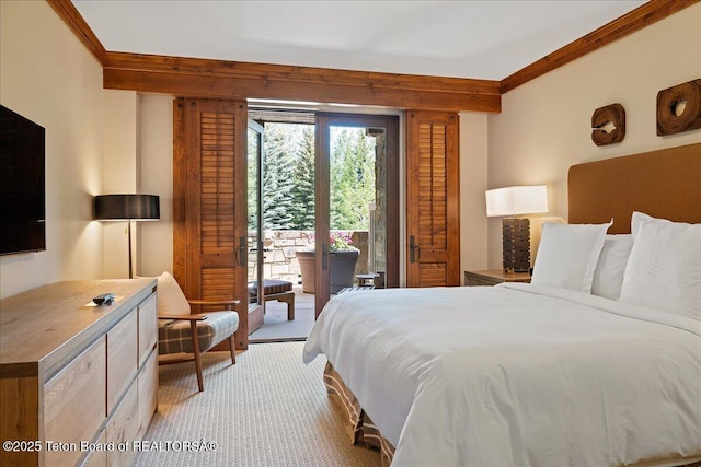 carpeted bedroom featuring crown molding and access to exterior