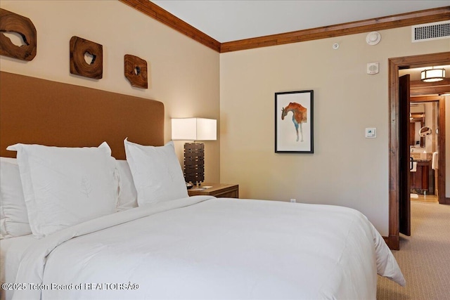 carpeted bedroom featuring crown molding