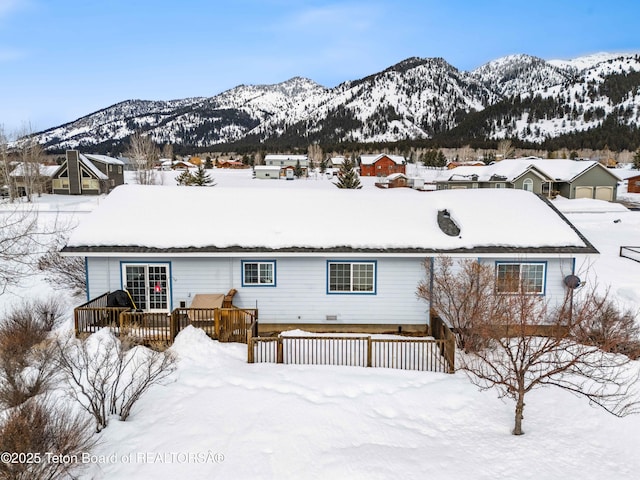 exterior space featuring a deck with mountain view