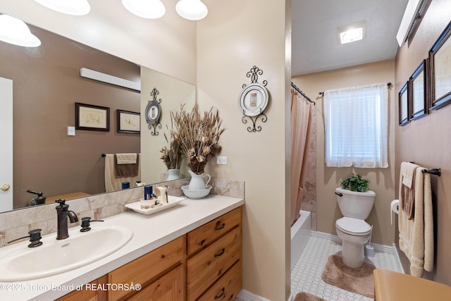 full bathroom featuring vanity, tile patterned floors, toilet, and shower / bath combo