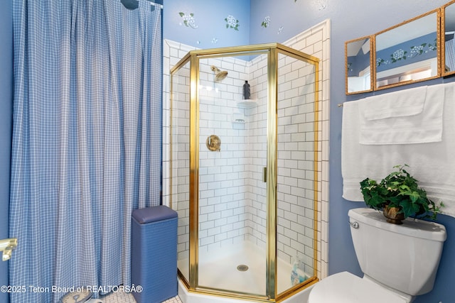 bathroom with toilet and an enclosed shower