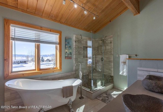 bathroom with wood ceiling, rail lighting, vanity, vaulted ceiling, and separate shower and tub