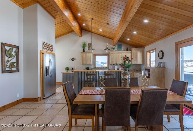 dining space featuring wood ceiling, plenty of natural light, beam ceiling, and light tile patterned floors