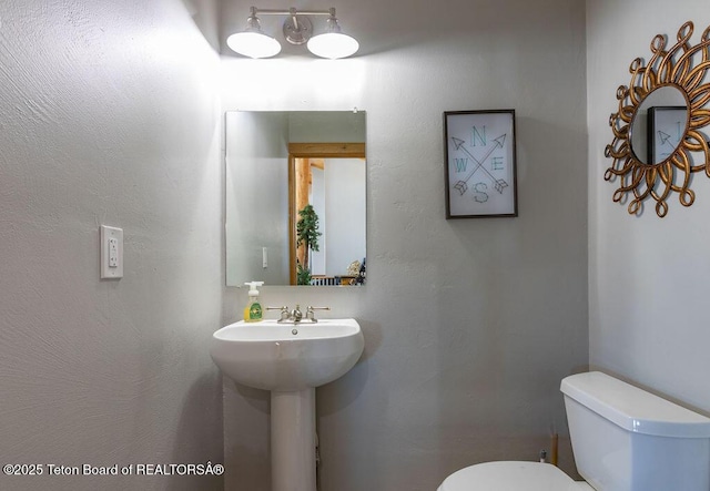 bathroom with sink and toilet