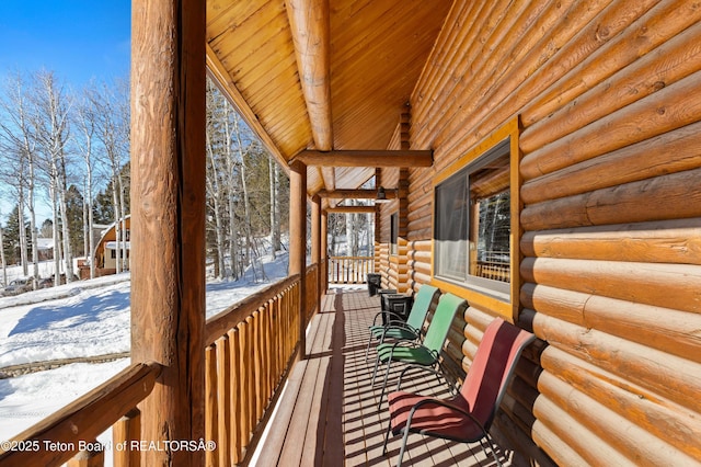 view of snow covered deck