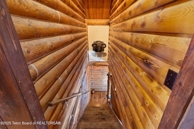 interior space featuring hardwood / wood-style flooring and log walls