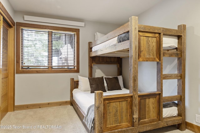 carpeted bedroom featuring a closet