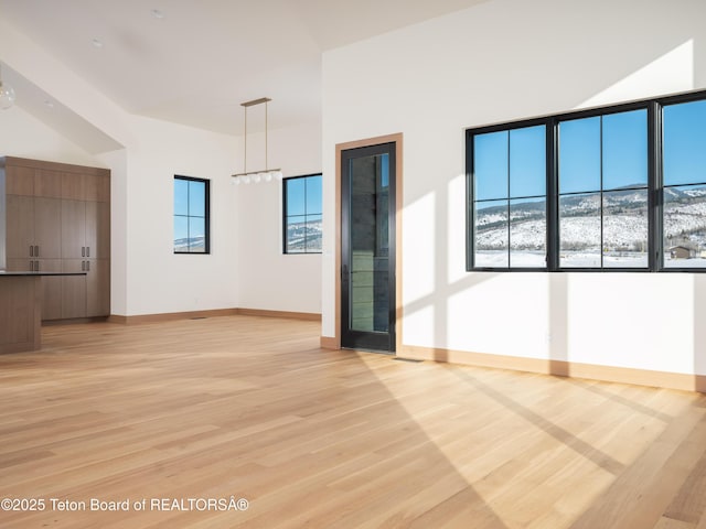 spare room with light hardwood / wood-style floors