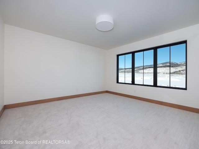 carpeted empty room featuring a healthy amount of sunlight