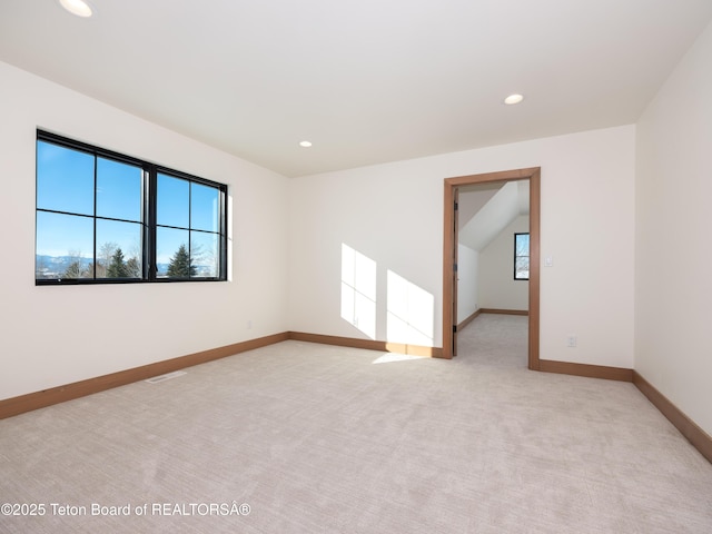 unfurnished room with light colored carpet