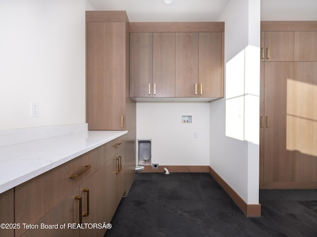 laundry room featuring cabinets, gas dryer hookup, and washer hookup