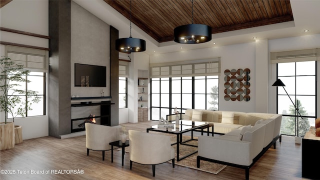 living room with wood ceiling, a healthy amount of sunlight, a premium fireplace, and a high ceiling