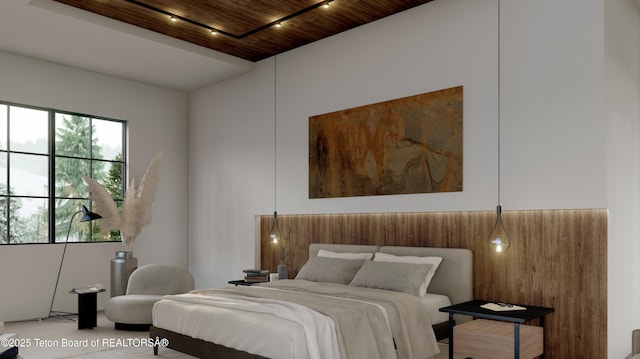 bedroom with wood ceiling and rail lighting