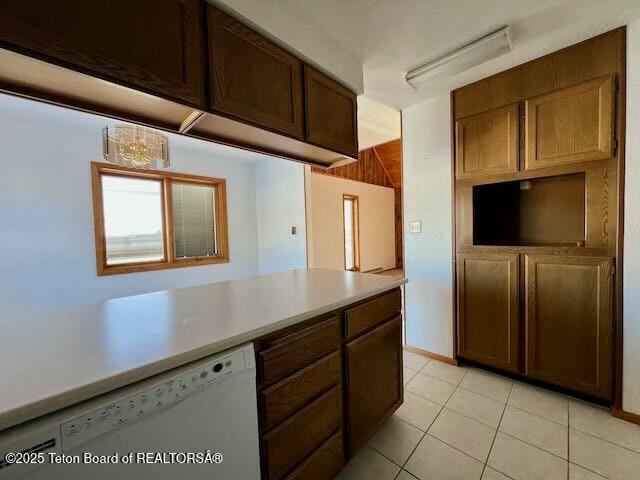 kitchen featuring light tile patterned floors and dishwasher