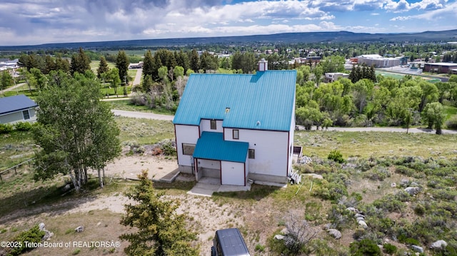 19 Orcutt Dr, Pinedale, WY 82941 - view from above of property featuring a mountainous background and a tree filled landscape