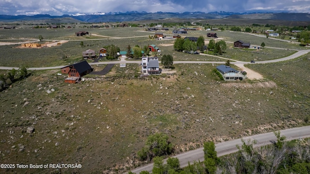 19 Orcutt Dr, Pinedale, WY 82941 - aerial view of sparsely populated area with a mountain backdrop