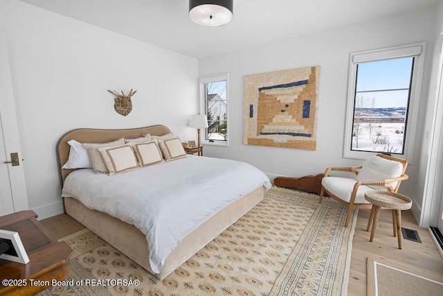 bedroom with light hardwood / wood-style floors