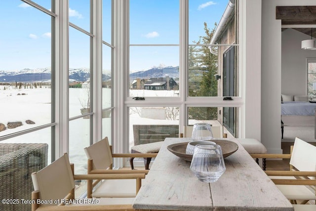 sunroom with a mountain view