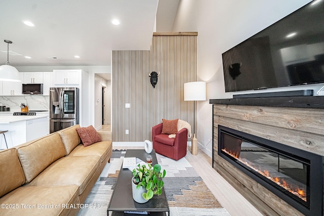 living room with light hardwood / wood-style flooring