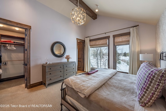 380 Cottongrass Rd, Driggs, ID 83422 - bedroom featuring light carpet, a chandelier, a spacious closet, and baseboards