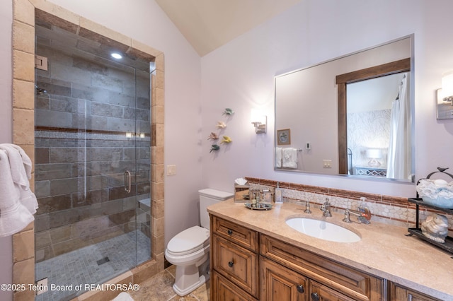 380 Cottongrass Rd, Driggs, ID 83422 - bathroom featuring toilet, a stall shower, lofted ceiling, vanity, and tasteful backsplash