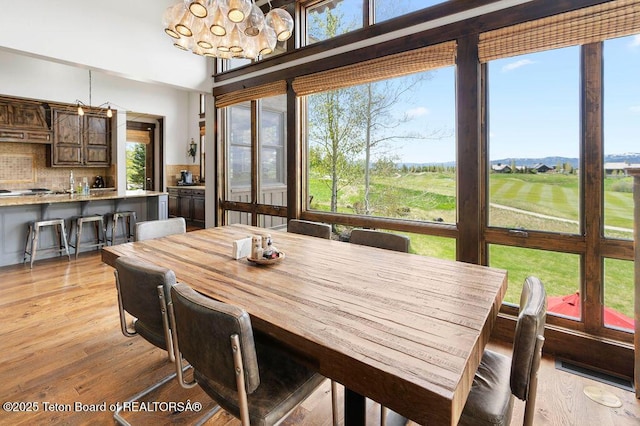 380 Cottongrass Rd, Driggs, ID 83422 - dining space featuring a chandelier and light wood-type flooring