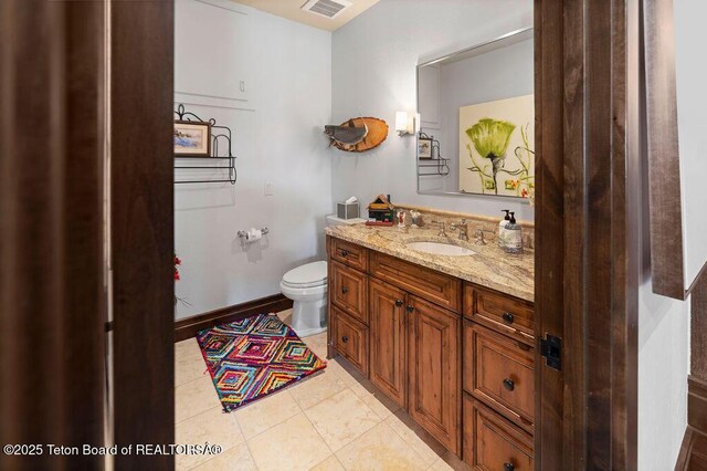 380 Cottongrass Rd, Driggs, ID 83422 - bathroom with vanity, toilet, and tile patterned flooring