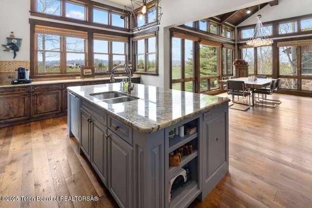 380 Cottongrass Rd, Driggs, ID 83422 - kitchen with a sink, a chandelier, plenty of natural light, wood-type flooring, and beamed ceiling