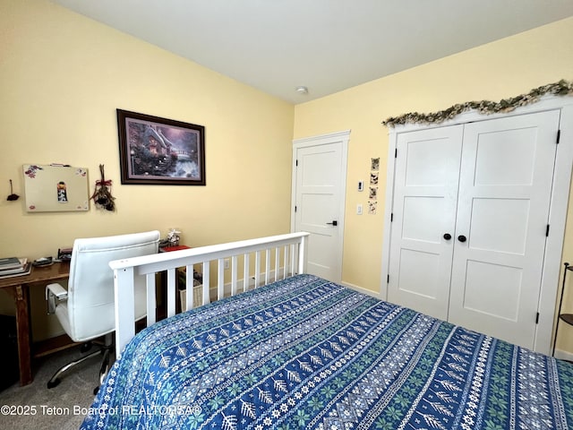 carpeted bedroom featuring a closet