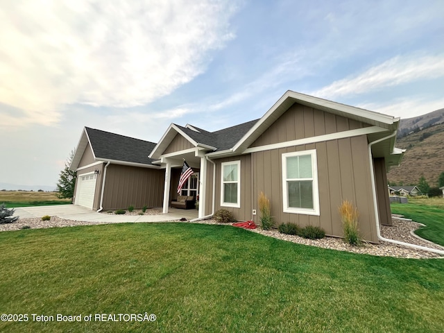 view of front of property with a garage and a front yard