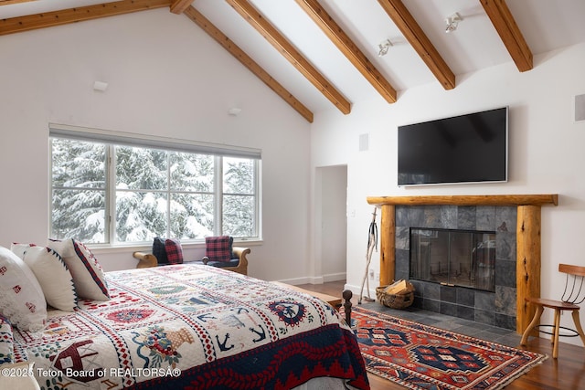 bedroom with a fireplace, wood finished floors, high vaulted ceiling, beamed ceiling, and baseboards