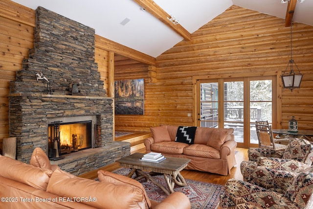 living room featuring log walls, a stone fireplace, wood finished floors, high vaulted ceiling, and beamed ceiling