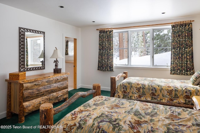 bedroom featuring carpet flooring and baseboards