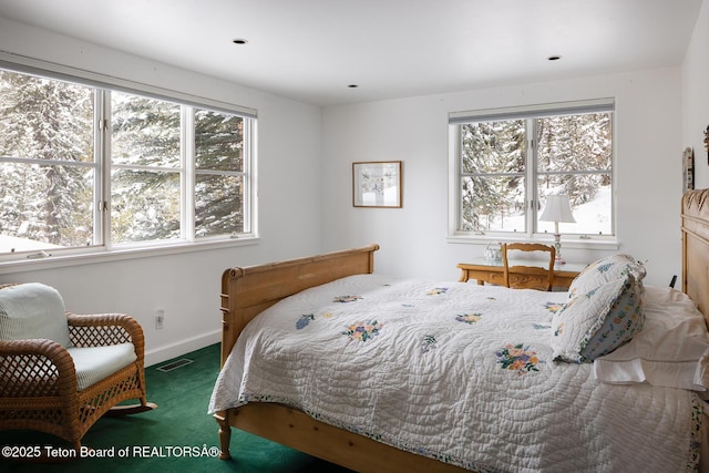 bedroom with carpet flooring, visible vents, and baseboards