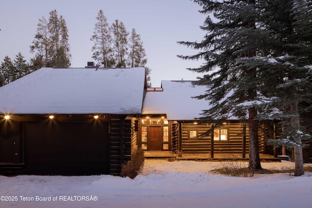 cabin with log exterior