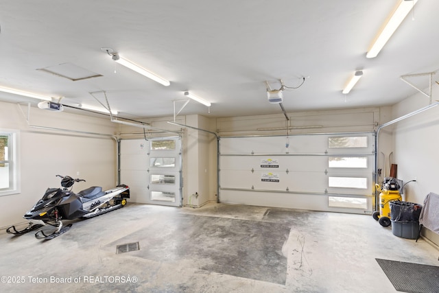 garage featuring a garage door opener