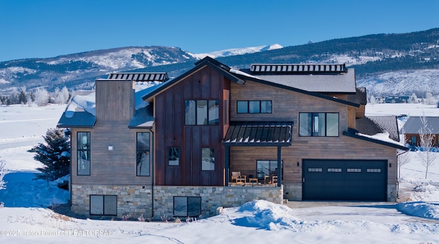 10 Bison Dr, Victor, ID 83455 - view of front of home with a garage and a mountain view