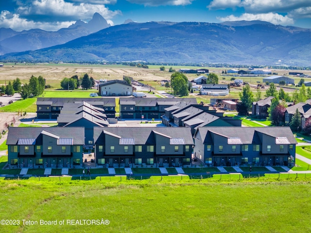 birds eye view of property featuring a mountain view