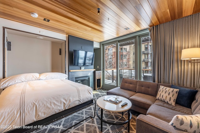 bedroom featuring floor to ceiling windows, access to outside, and wood ceiling