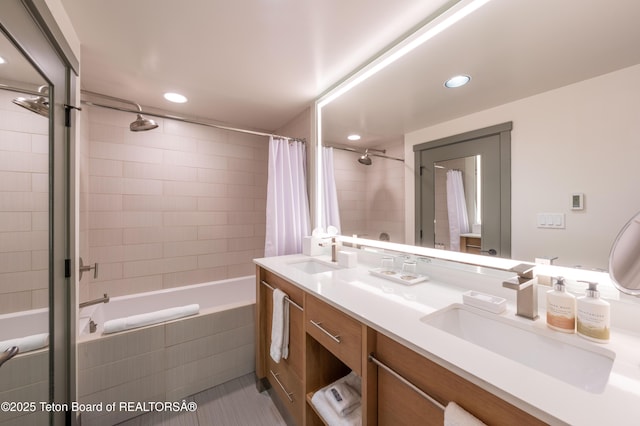 bathroom featuring shower / bath combo and vanity