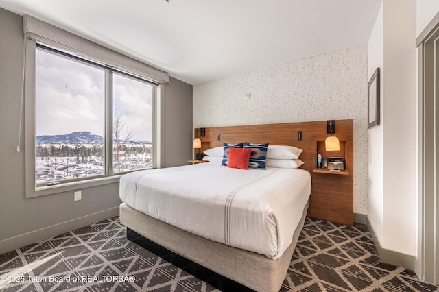 bedroom featuring a mountain view