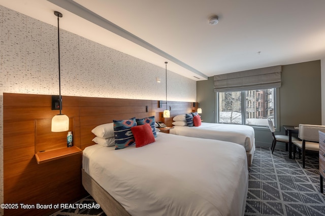 bedroom featuring lofted ceiling and wood walls