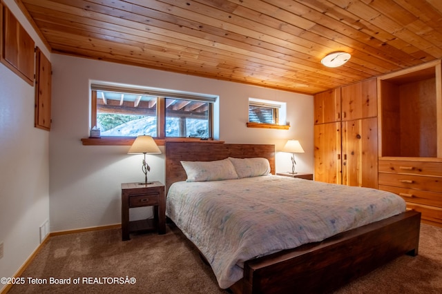 bedroom featuring wooden ceiling, carpet flooring, visible vents, and baseboards