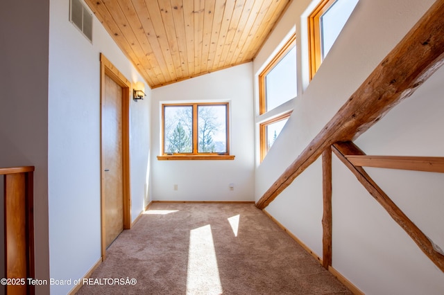 additional living space with light carpet, baseboards, visible vents, lofted ceiling, and wooden ceiling