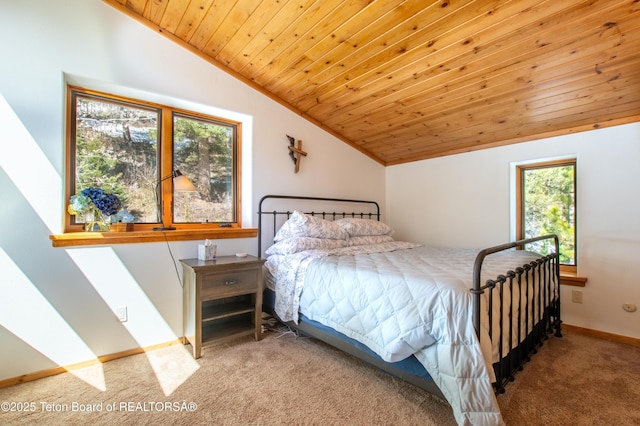 carpeted bedroom with lofted ceiling, wooden ceiling, and baseboards