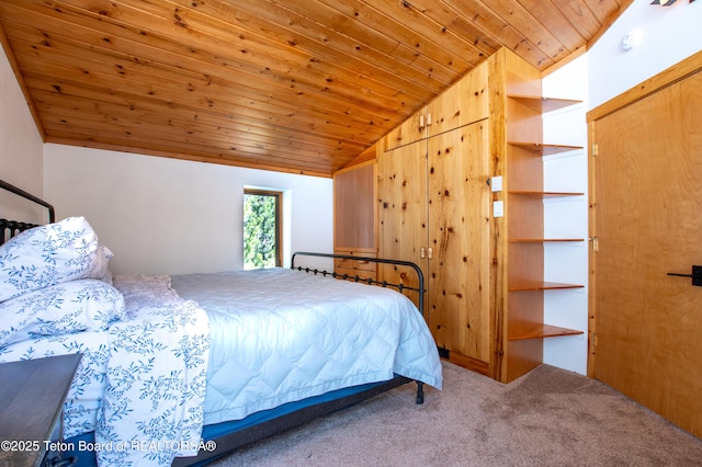 bedroom featuring carpet, wood ceiling, and vaulted ceiling